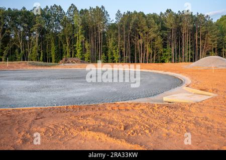 Flat road gravel subbase in new construction residential subdivision Stock Photo