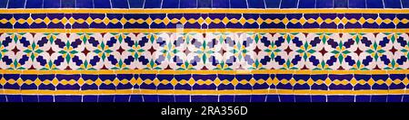 Composition of typical maroccan wall decorations with colored ceramic tiles called azulejos with a geometric design - It's a seamless texture,  useful Stock Photo