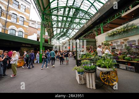 Borough Market in London, street market, farmers market with food stalls, street food, shops, food trucks and farm to table food to go or take away. Stock Photo