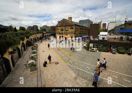 Coal Drops Yard in London is a redeveloped coal yard, now an outdoor mall, market with shops, outdoor movie theatre, restaurants and entertainment. Stock Photo