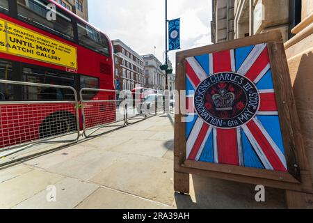 The Coronation of King Charles III brings pride, and a festive atmosphere in London. A traditional English pub posts a Coronation sign in Westminster. Stock Photo