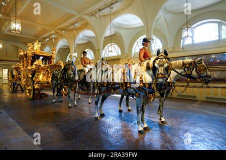 Royal Gold State Coach at the Royal Mews in London. King Charles III, Queen Camilla rode in the Gold State Coach during the Coronation on May 6, 2023. Stock Photo