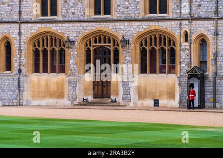 Windsor Castle Guard. Windsor Castle is one of three official residences of the King and a popular tourist attraction. Enjoy the changing of the guard Stock Photo