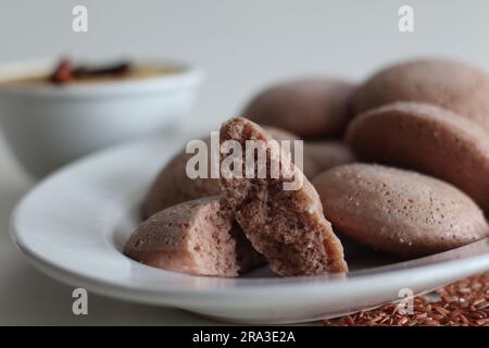 Navara rice idly. Steamed savoury rice cake made by a batter of fermented de husked black lentils and navara rice. Navara rice is an endemic rice with Stock Photo