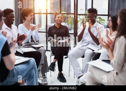 Business lecture. Happy executives , listening his speech in boardroom Stock Photo