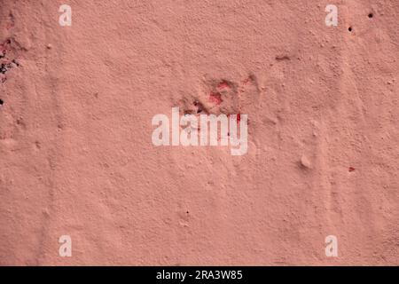 coral paint background on concrete wall as background close up Stock Photo