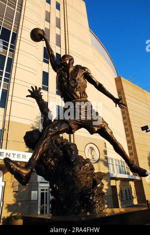 A statue sculpture at the United Center in Chicago depicts Michael Jordan dunking on an opponent Stock Photo