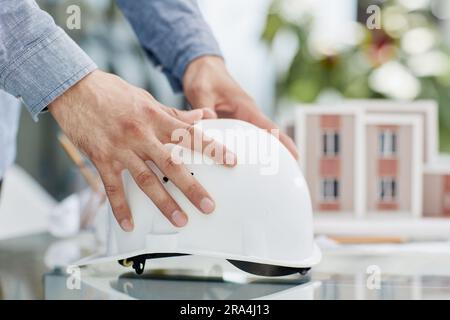 Close up white safety helmet on the table Stock Photo