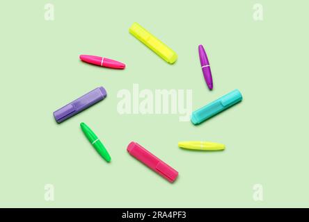 Frame made of colorful markers on green background Stock Photo