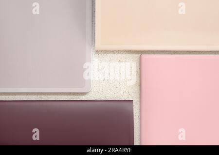 Different colorful notebooks on grunge light background Stock Photo