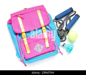 Backpack with badminton shuttlecock, skipping rope and tennis ball isolated  on white background Stock Photo