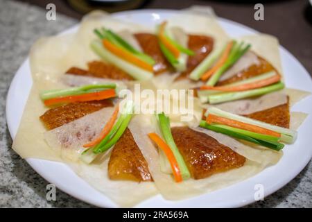 Deep fried Peking duck skin, served on plate Stock Photo