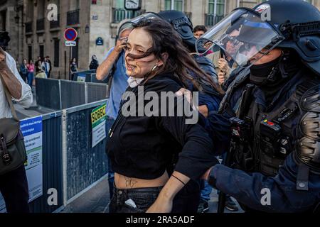 Paris, France. 30th June, 2023. A teenager is being arrested by the police during the spontaneous demonstration. On the fourth day of protests following the death of 17-year-old Nahel by police in Nanterre, on the outskirts of Paris, a spontaneous demonstration began in Place de la Concorde and brought together a few hundred people. There were some arrests. Credit: SOPA Images Limited/Alamy Live News Stock Photo