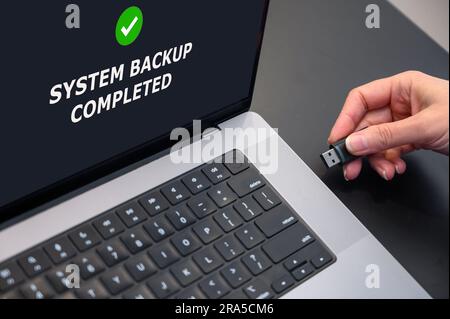 backing up data to an external flash drive. Secure data storage. Stock Photo