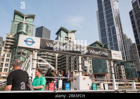 Passengers embarking onto a Thames Clipper from Vauxhall Pier, St Georges Wharf, Vauxhall, London, England, U.K. Stock Photo