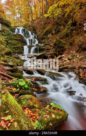 Beautiful Waterfall Shipot in the autumn forest of the Carpathian Mountains Stock Photo