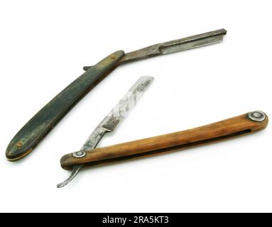 Two wooden cutthroat razors isolated on a white background Stock Photo