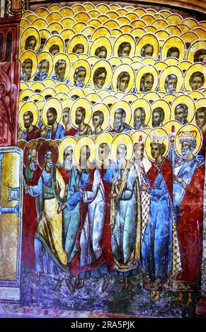 Gura Humorului, Suceava County, Romania, 1999. Painted exterior wall of Voronet Monastery, a historical monument from 1488. Fresco depicting the saints of the church led by St. Peter. Stock Photo