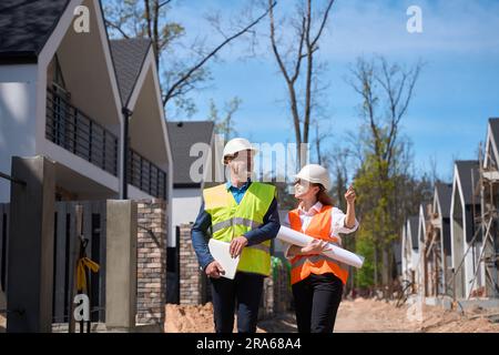 Woman designer sharing her ideas and thoughts about landscape development Stock Photo