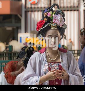 Hong Kong, China -- March 11, 2023. Porrait of a Chinese woman with an elaborate hair-do wearing a wedding outfit. Stock Photo