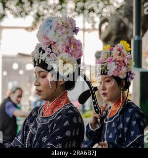 Hong Kong, China -- March 11, 2023. Chinese women wearing traditional wedding dress outfits. Stock Photo