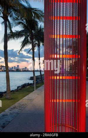 Miami Beach, Florida, USA. Eye-catching turtle-friendly light installation in South Pointe Park, South Beach, dusk, Downtown Miami in background. Stock Photo