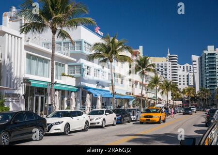 Miami Beach, Florida, USA. Typical yellow taxi making its way along Ocean Drive, Miami Beach Architectural District, South Beach. Stock Photo