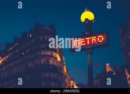 Metro Sign In A Residential Area Of Paris, France At Night Stock Photo