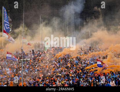 SPIELBERG - Dutch fans celebrate after Max Verstappen's (Red Bull Racing) win at the Sprint Race leading up to the Austrian Grand Prix at the Red Bull Ring on July 1, 2023 in Spielberg, Austria. ANP SEM VAN DER WAL Stock Photo
