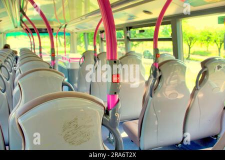 empty first bus seats red press switch Stock Photo