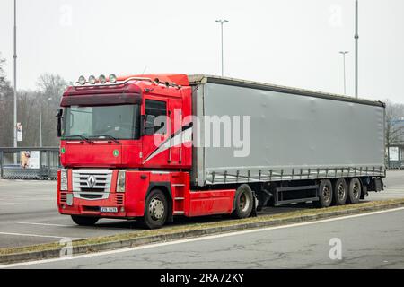 Relaxed Caucasian Truck Driver Seating on the Ground and Support His Back  on the Semi Truck Wheel Stock Photo - Alamy