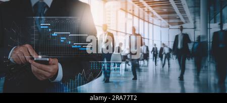 An analyst uses smartphone and dashboard for data business analysis and Data Management System with KPI and metrics connected to the database for tech Stock Photo