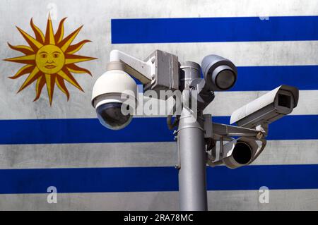 Closed circuit camera Multi-angle CCTV system against the background of the national flag of Uruguay. Stock Photo