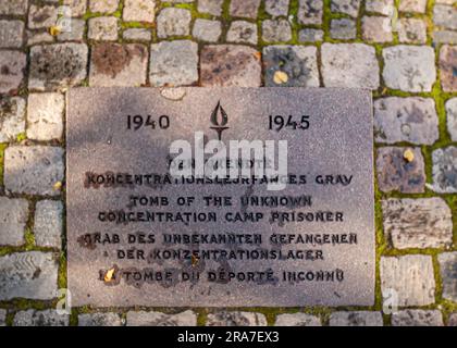 Copenhagen, Denmark - September 15, 2010: Helligaandskirken or church of the Holy Spirit. Memorial on walkway: Tomb of the unknown concentration camp Stock Photo