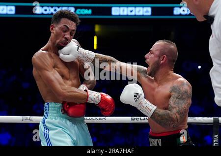 Ben Whittaker (left) and in action against Vladimir Belujsky during their Light-heavyweight bout at the AO Arena, Manchester. Picture date: Saturday July 1, 2023. Stock Photo