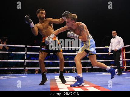 Sam Maxwell (left) and Dalton Smith in action during their British and Commonwealth Super-Lightweight Titles bout at the Utilita Arena Sheffield. Picture date: Saturday July 1, 2023. Stock Photo