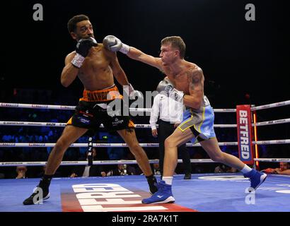 Sam Maxwell (left) and Dalton Smith in action during their British and Commonwealth Super-Lightweight Titles bout at the Utilita Arena Sheffield. Picture date: Saturday July 1, 2023. Stock Photo