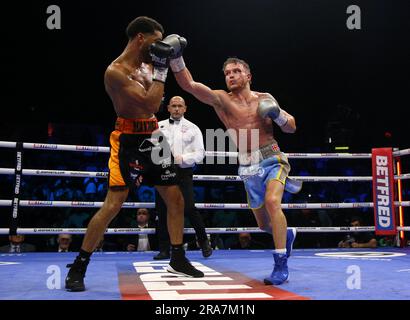 Sam Maxwell (left) and Dalton Smith in action during their British and Commonwealth Super-Lightweight Titles bout at the Utilita Arena Sheffield. Picture date: Saturday July 1, 2023. Stock Photo