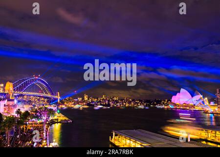 Circular quay harbour waterfront in Sydney city at Vivid Sydney winter light festival. Stock Photo