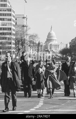 Jimmy Carter and his family - after being  sworn in as 39th President of the United States - walks down Pennsylvania Avenue on the way to the White House. By Carter's side is his wife, Rosalynn and daughter Amy. Photograph by Bernard Gotfryd Stock Photo