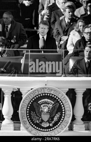 Jimmy Carter is sworn in as 39th President of the United States by Supreme Court Chief Justice Warren Burger. By Carter's side is his wife, Rosalynn and Vice President Walter Mondale. Photograph by Bernard Gotfryd Stock Photo