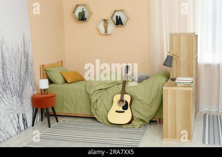 Background image of cozy teenage bedroom with a lot of accessories and comfortable  bed, copy space Stock Photo