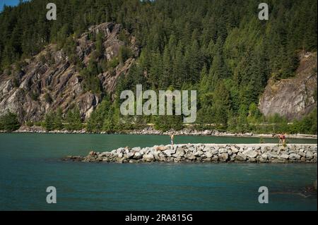 Tourists at Porteau Cove Provincial Park, along Howe Sound, near Squamish BC, Canada. Stock Photo