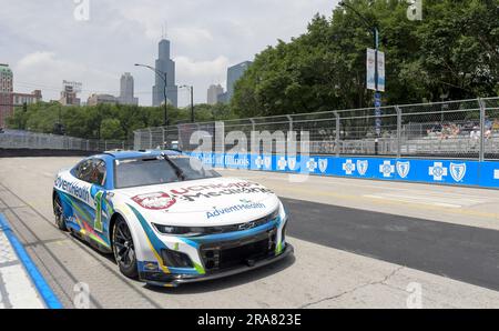 Chicago, United States. 01st July, 2023. The iconic Willis Tower (Sears Tower) rises over the course as NASCAR Cup Series driver Ross Chastain (1) comes out of turn 1 during Grant Park 220 NASCAR Cup Series practice in Chicago on Saturday, July 1, 2023. Photo by Mark Black/UPI Credit: UPI/Alamy Live News Stock Photo