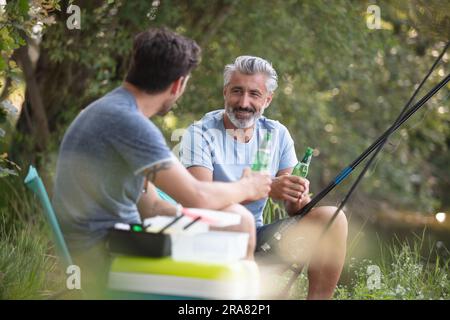 two men are fishing at summer time Stock Photo