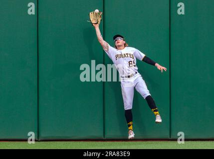 Pittsburgh Pirates center fielder Jack Suwinski looks out of the dugout  before the start of a baseball game against the Miami Marlins, Friday, June  23, 2023, in Miami. (AP Photo/Wilfredo Lee Stock