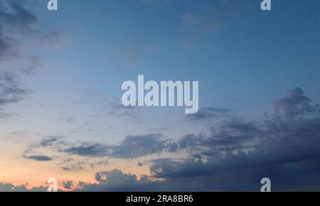 Evening twilight under a slightly cloudy sky Stock Photo - Alamy