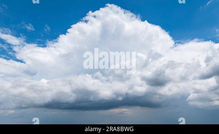 Mighty, rising thundercloud in sunshine Stock Photo