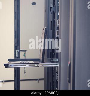 The terminal keyboard in the server room allows for easy access to critical data and information. Stock Photo