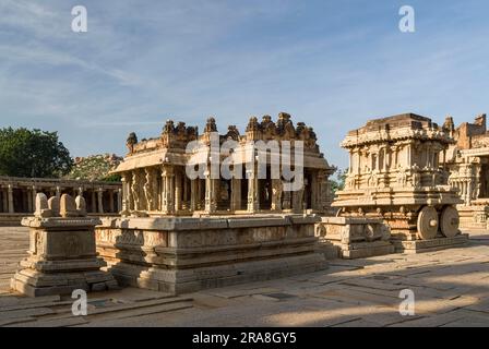 Bajana Mandap and stone chariot at the Vitthala Temple built in the 15th century A. D. during the reign of King Krishna Deva Raya in Hampi Stock Photo